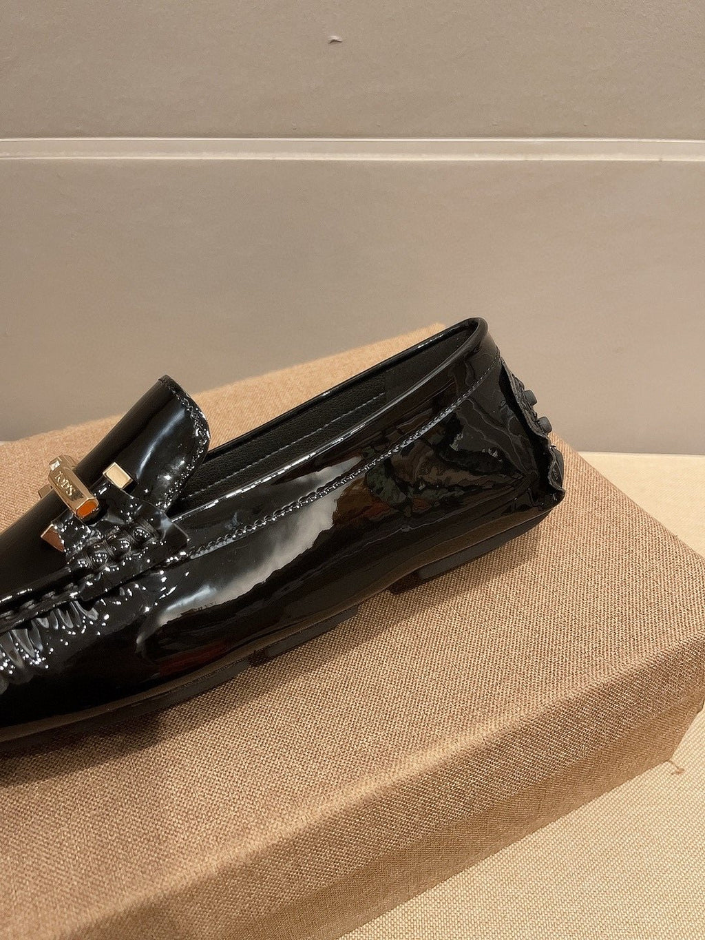 Tod's Glossy Metal Bar Loafers